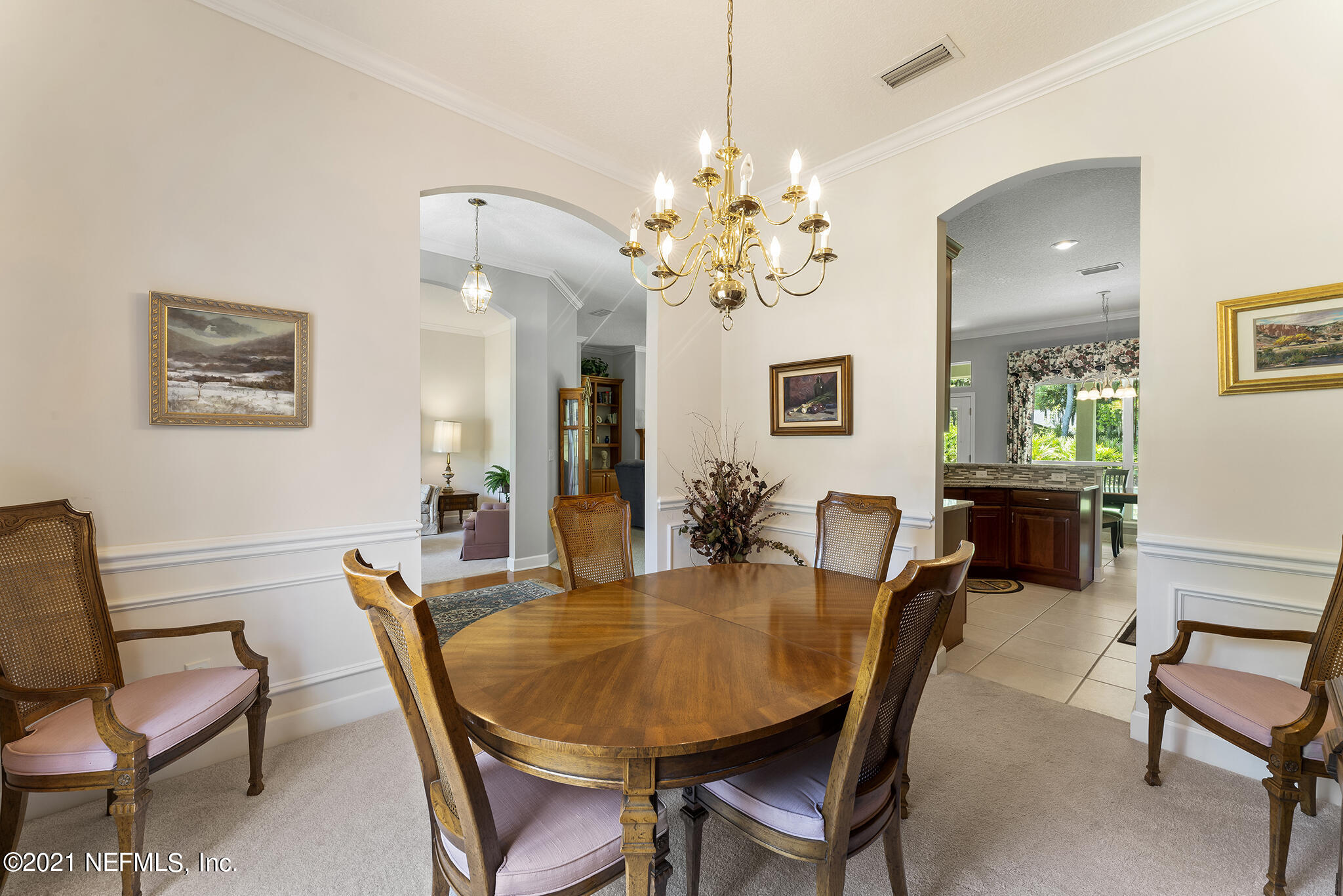 2284 Emilys Way Fleming Island, FL 32003 - Photo 7 of 52 a view of a dining room with furniture and chandelier