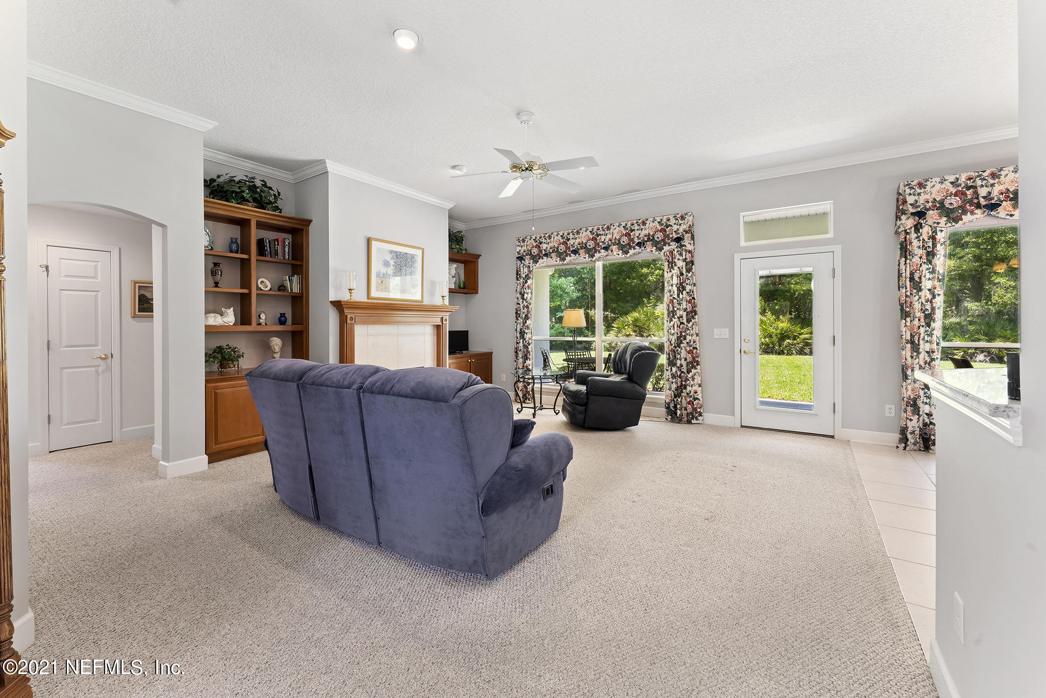 2284 Emilys Way Fleming Island, FL 32003 - Photo 10 of 52 a living room with furniture and a large window