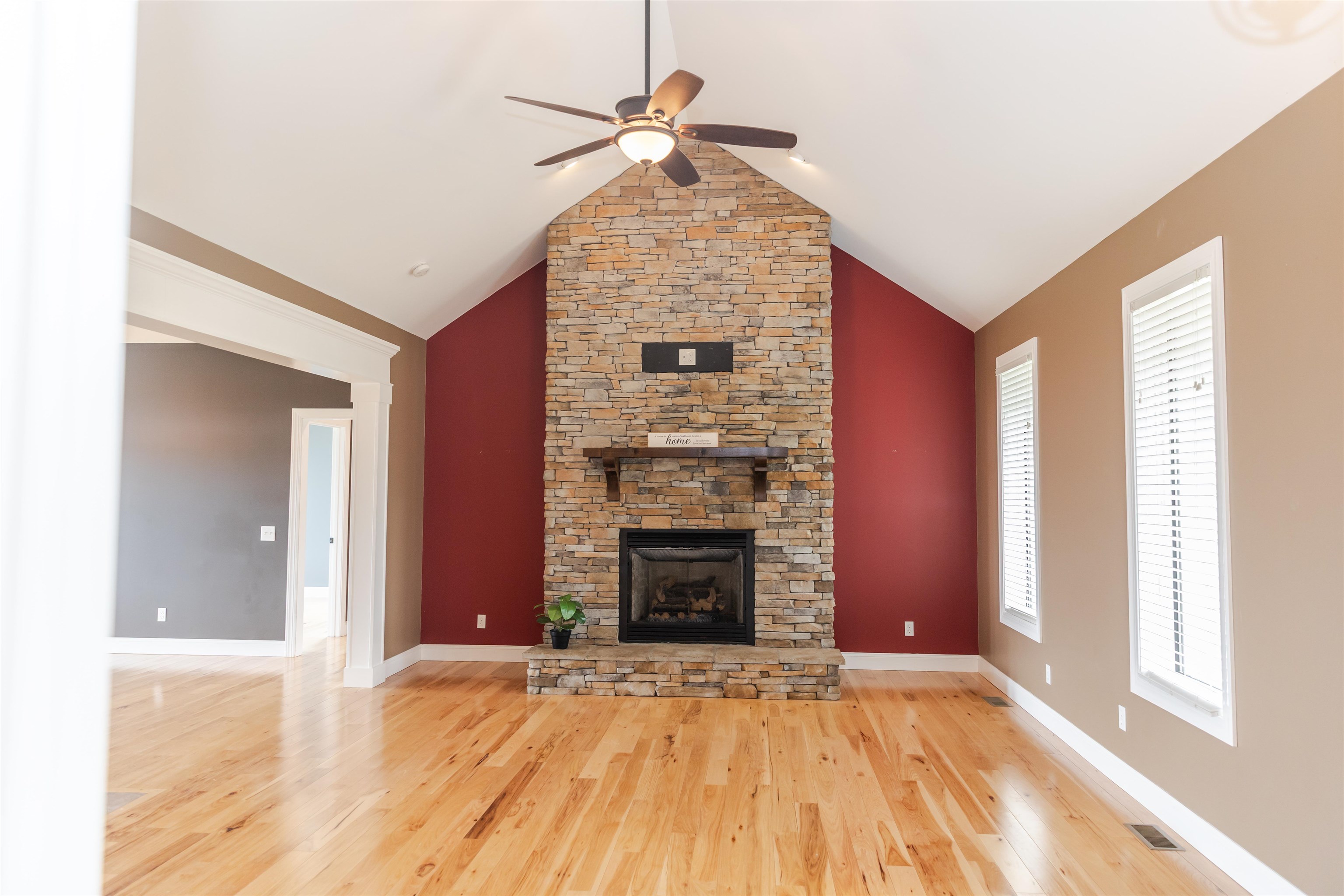 165 Marl Ridge Road Lexington, VA 24450 - Photo 11 of 72 a view of an empty room with a fireplace and a window