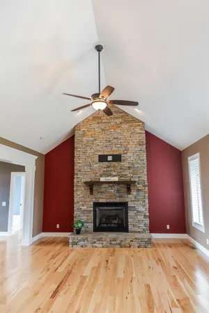 a kitchen with stainless steel appliances kitchen island granite countertop a refrigerator and a stove