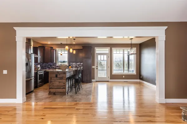a view of a livingroom with a window and a ceiling fan