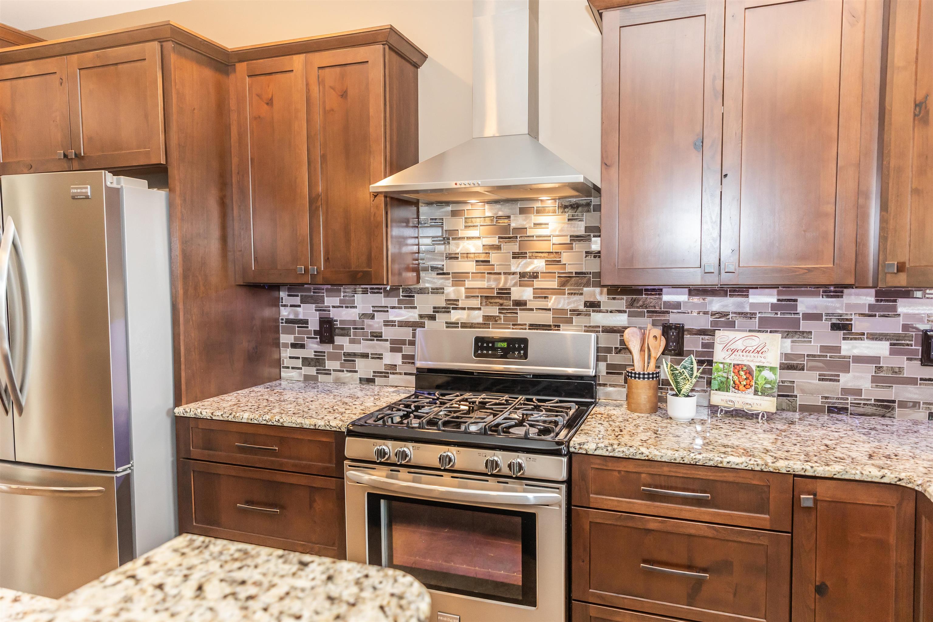 165 Marl Ridge Road Lexington, VA 24450 - Photo 17 of 72 a kitchen with granite countertop a stove a refrigerator and a sink