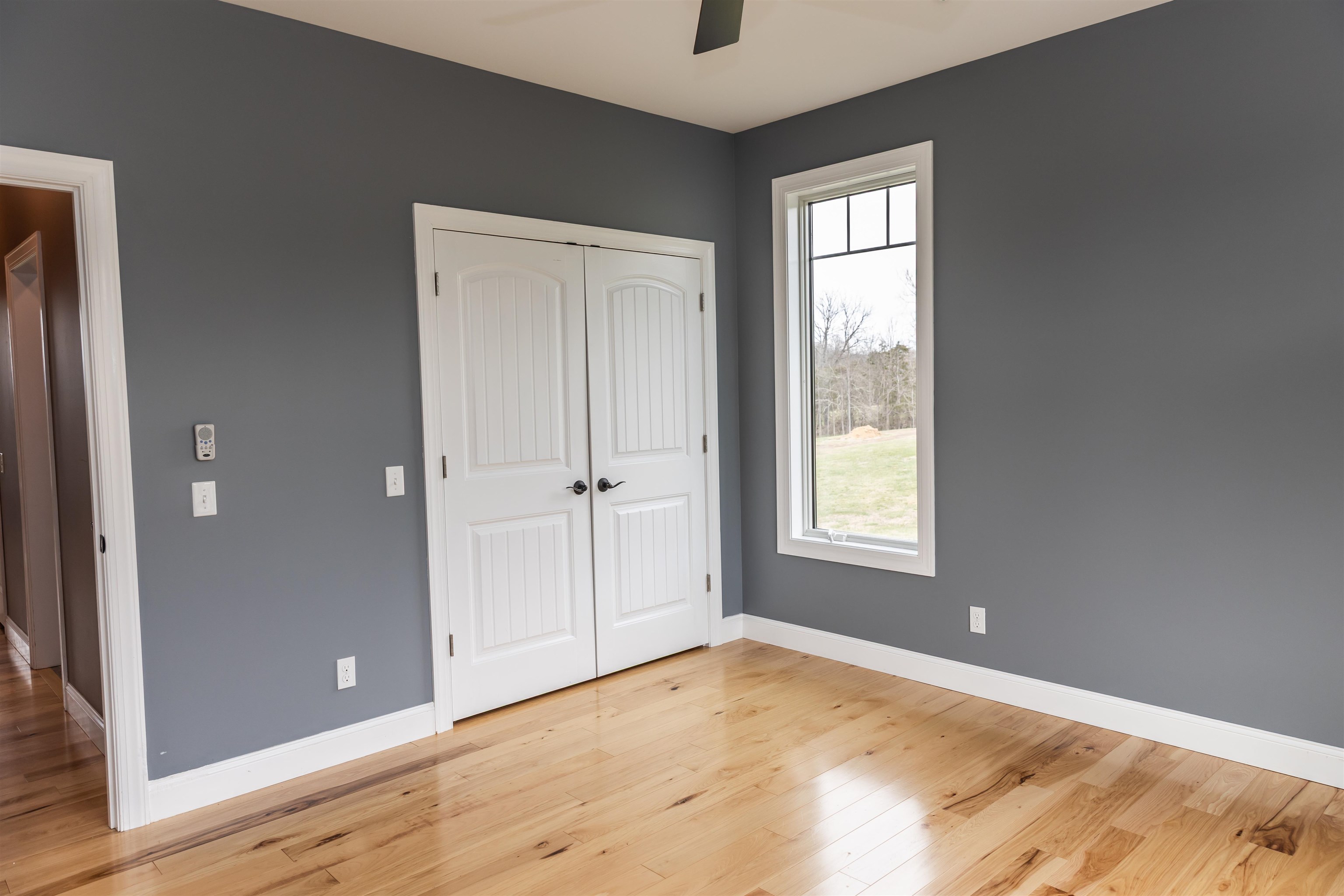 165 Marl Ridge Road Lexington, VA 24450 - Photo 57 of 72 a view of an empty room with wooden floor and a window
