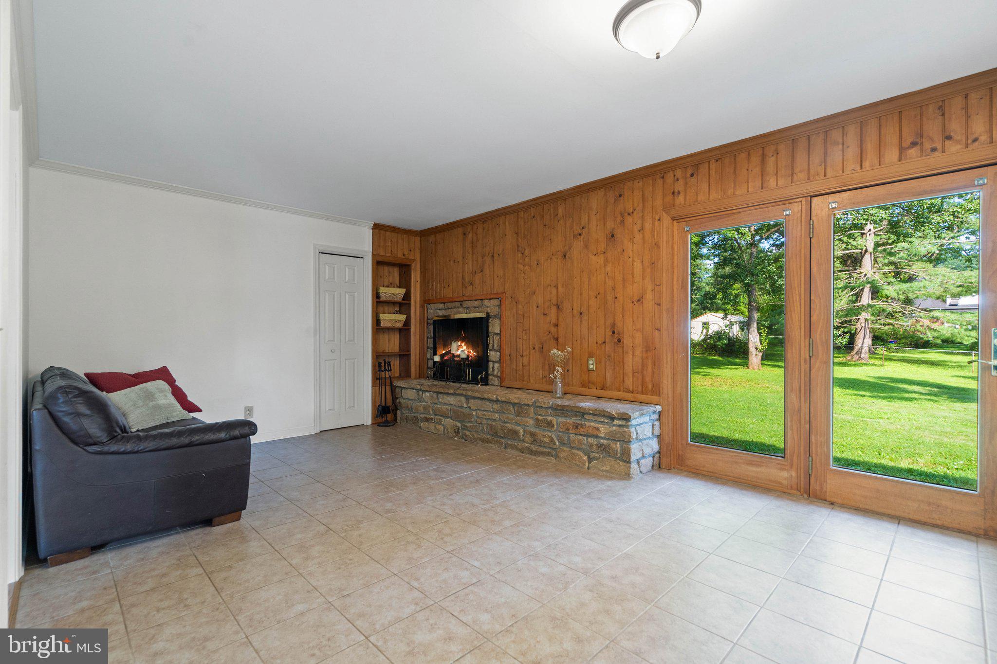 131 Moser Road Warrenton, VA 20186 - Photo 11 of 31 Open space with fireplace off of kitchen.