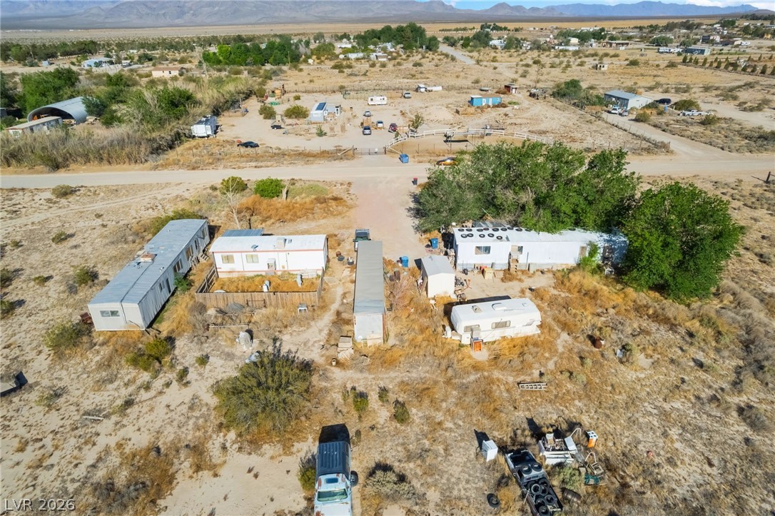 2350 Shawnee Street Sandy Valley, NV 89019 - Photo 27 of 38 Aerial view of property's location with a mountain backdrop, a desert landscape, and rural landscape