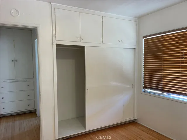 a view of cabinets and wooden floor