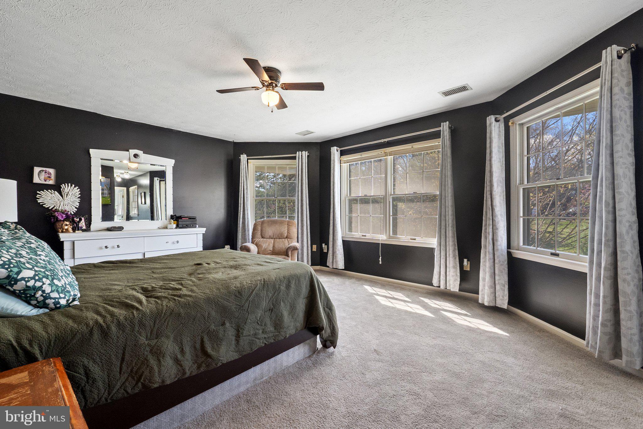 203 Holiday Road Cross Junction, VA 22625 - Photo 23 of 41 a spacious bedroom with a large bed and a large window