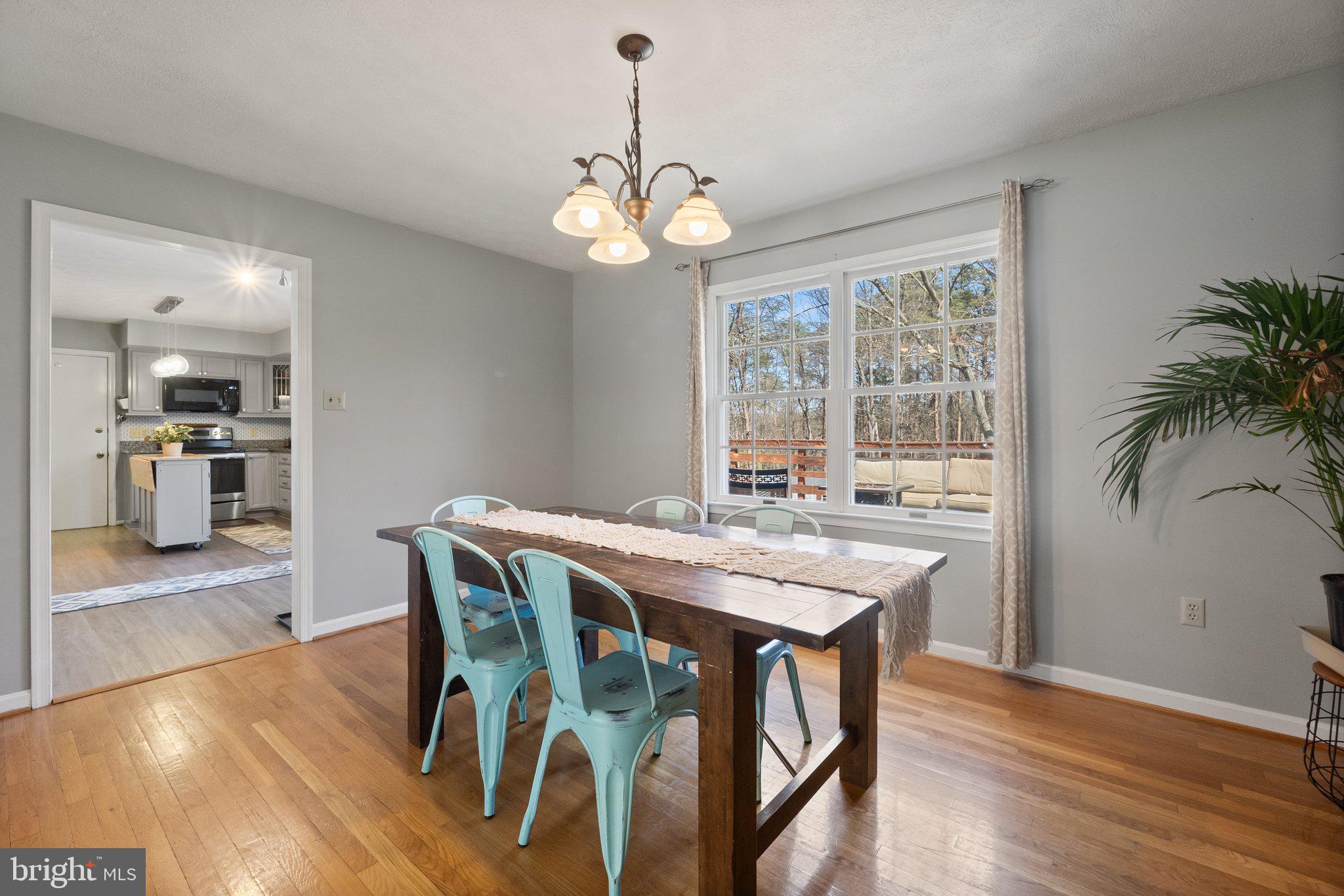203 Holiday Road Cross Junction, VA 22625 - Photo 8 of 41 a view of a dining room with furniture window and wooden floor