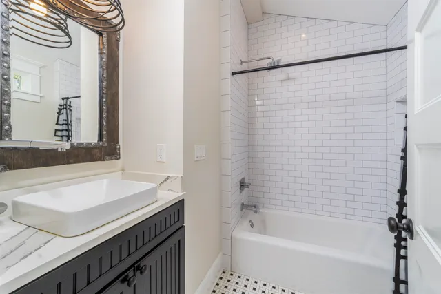 a picture of a bathroom with mirror