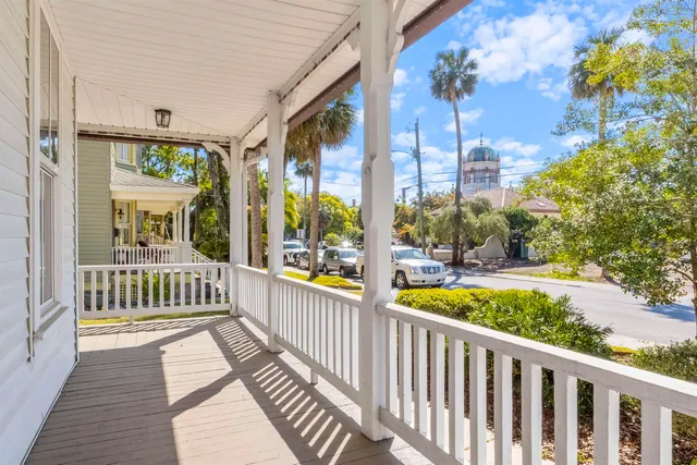 a view of a two chairs on the balcony