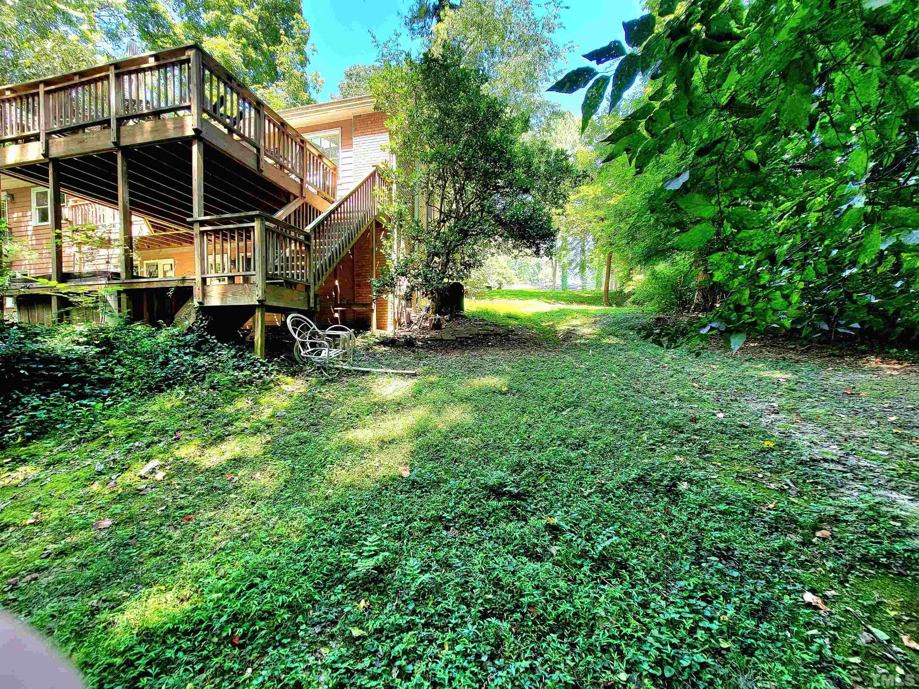 300 Dartmouth Road Raleigh, NC 27609 - Photo 21 of 52 a view of a house with a big yard and large trees