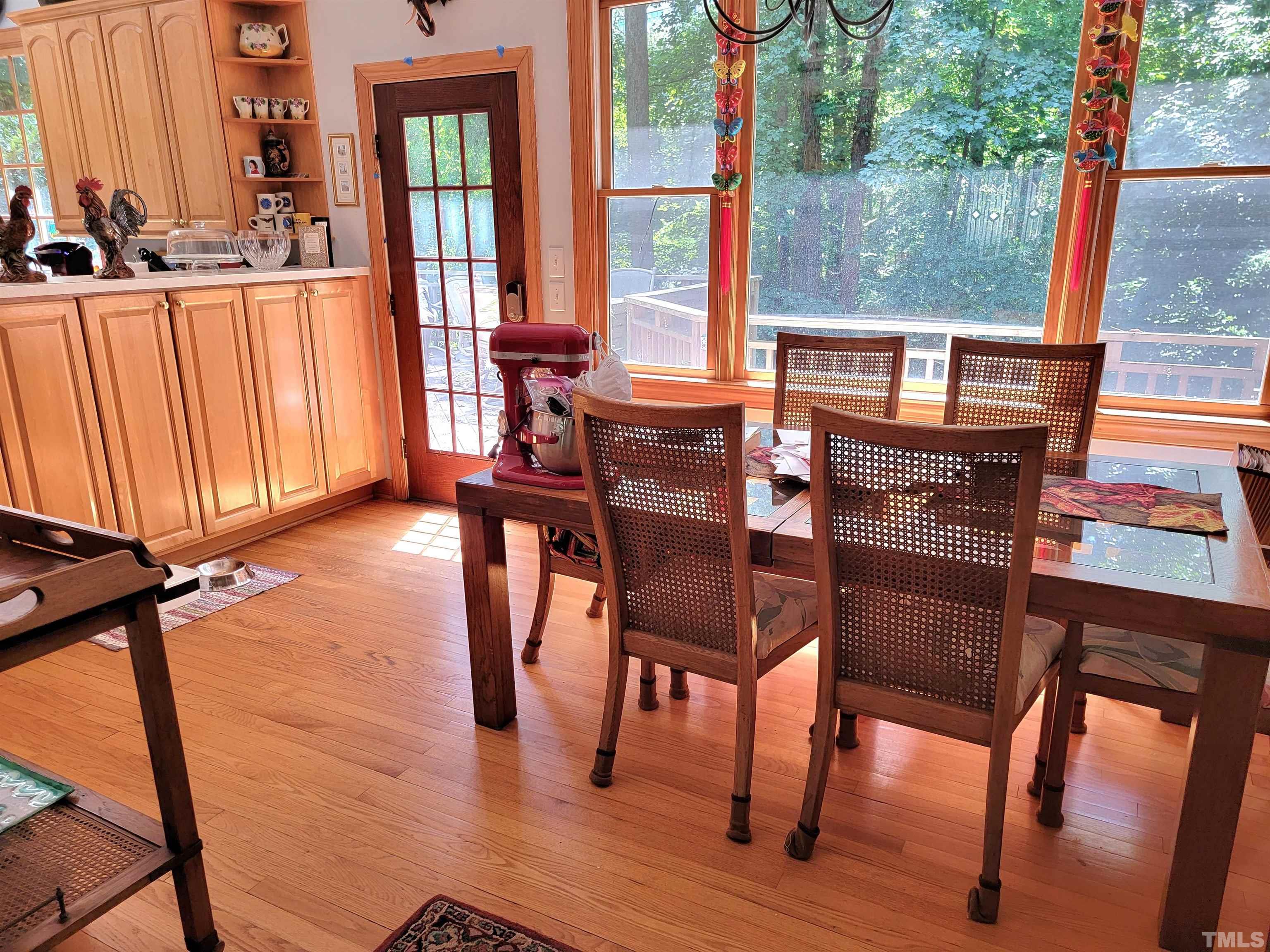 300 Dartmouth Road Raleigh, NC 27609 - Photo 24 of 52 a view of a dining room with furniture window and wooden floor