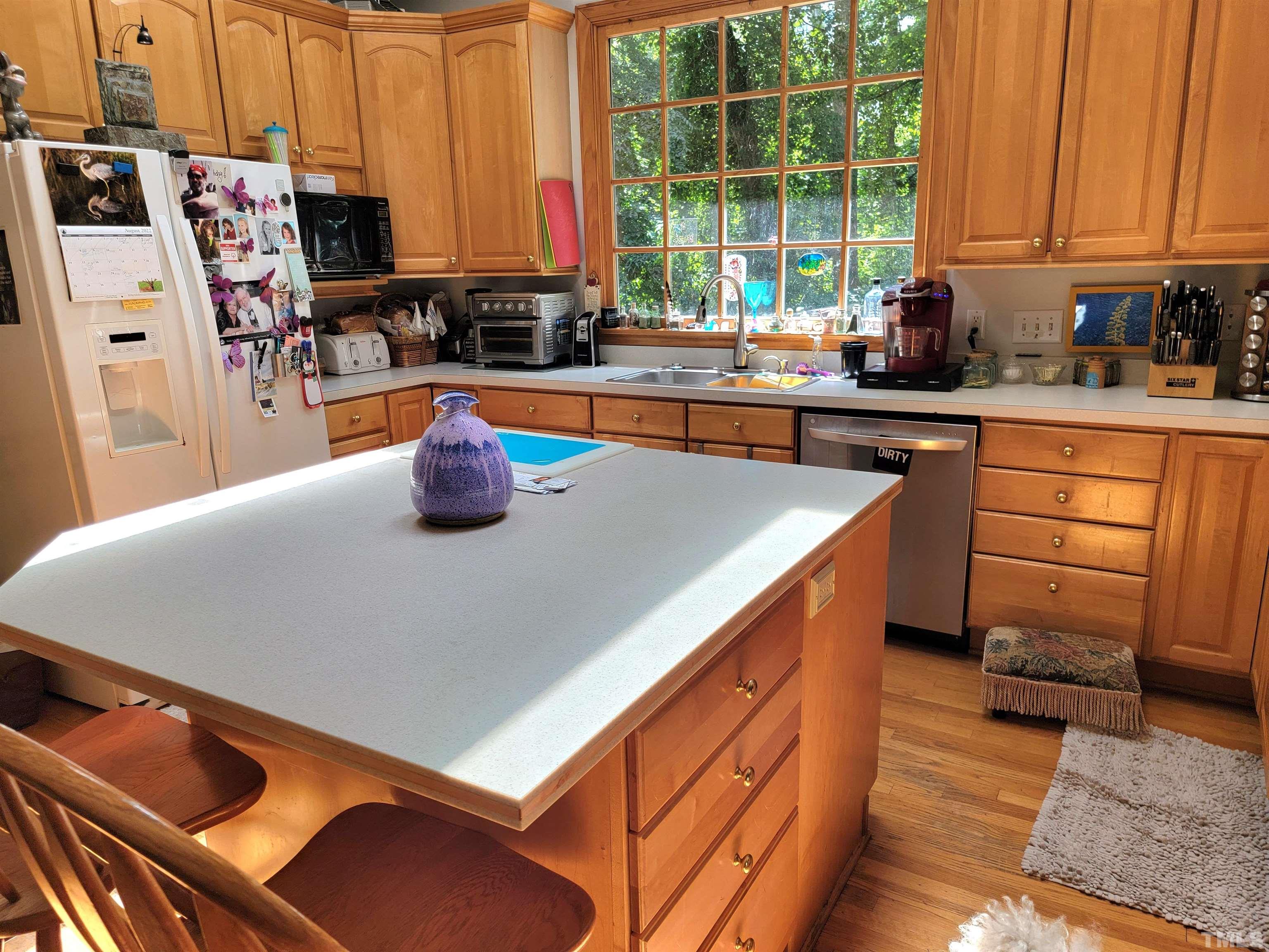 300 Dartmouth Road Raleigh, NC 27609 - Photo 25 of 52 a kitchen with stainless steel appliances a sink a stove and a refrigerator