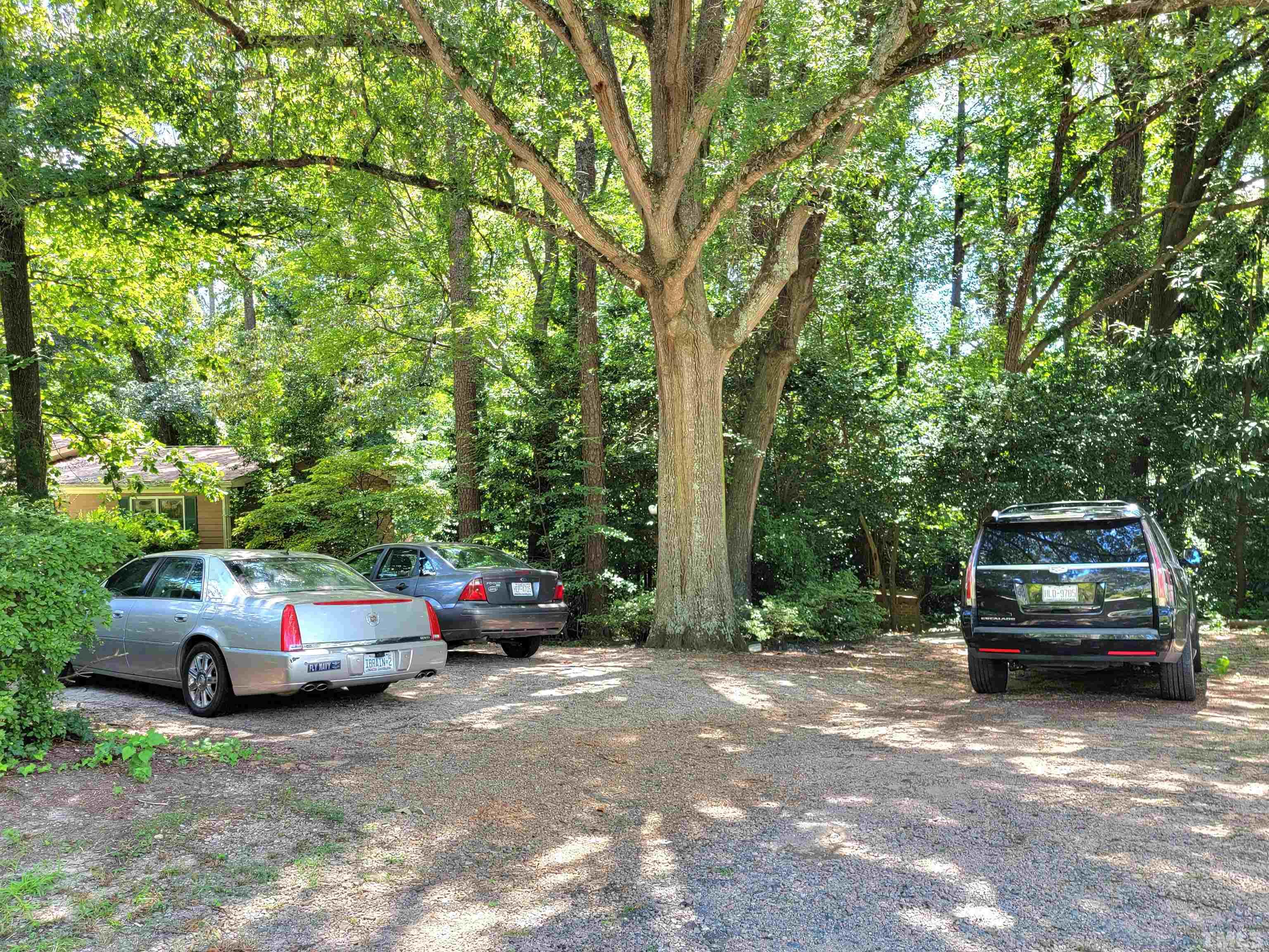 300 Dartmouth Road Raleigh, NC 27609 - Photo 38 of 52 a car parked in front of a house
