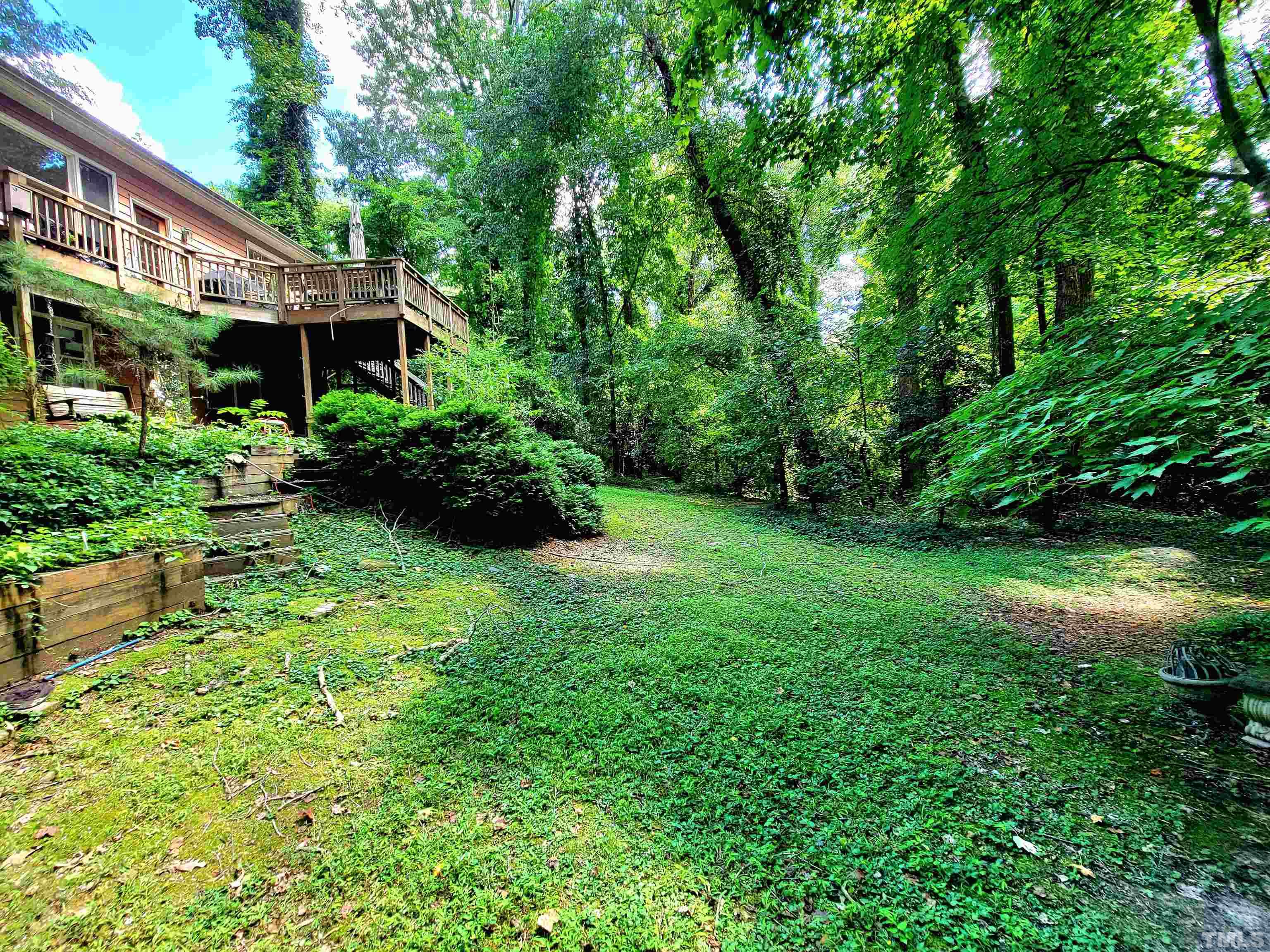 300 Dartmouth Road Raleigh, NC 27609 - Photo 5 of 52 a front view of a house with a yard