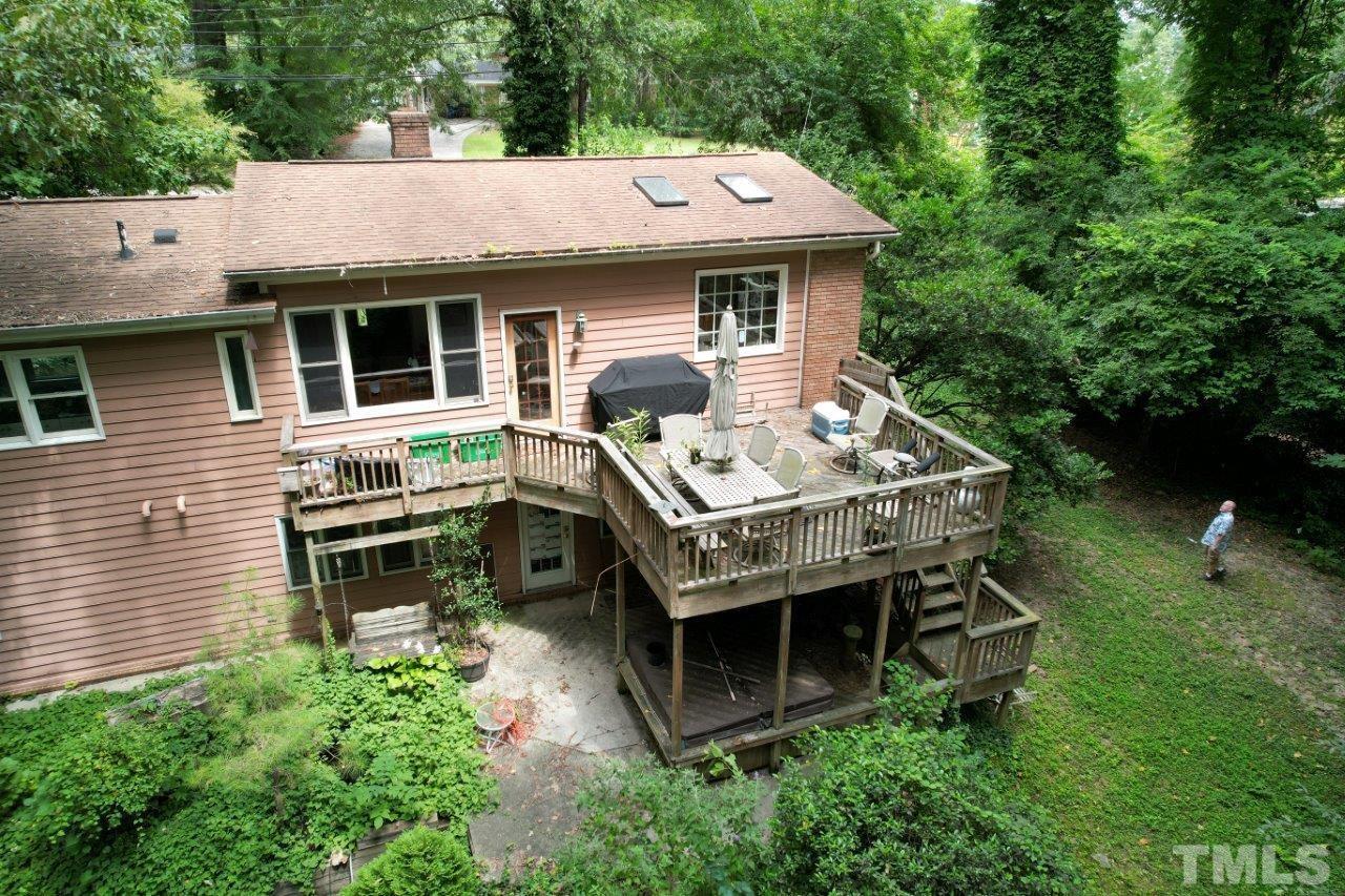 300 Dartmouth Road Raleigh, NC 27609 - Photo 51 of 52 a aerial view of a house with a yard porch and furniture
