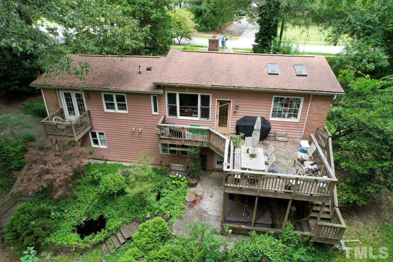 300 Dartmouth Road Raleigh, NC 27609 - Photo 10 of 52 an aerial view of a house with yard and trees in the background