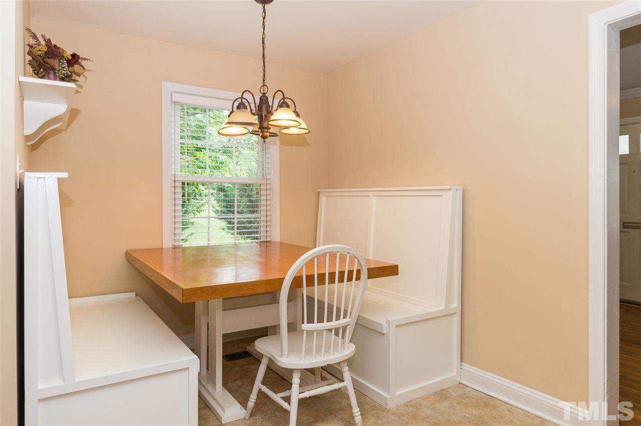 2132 Milburnie Road Raleigh, NC 27610 - Photo 11 of 23 a view of a dining room with furniture window and outside view