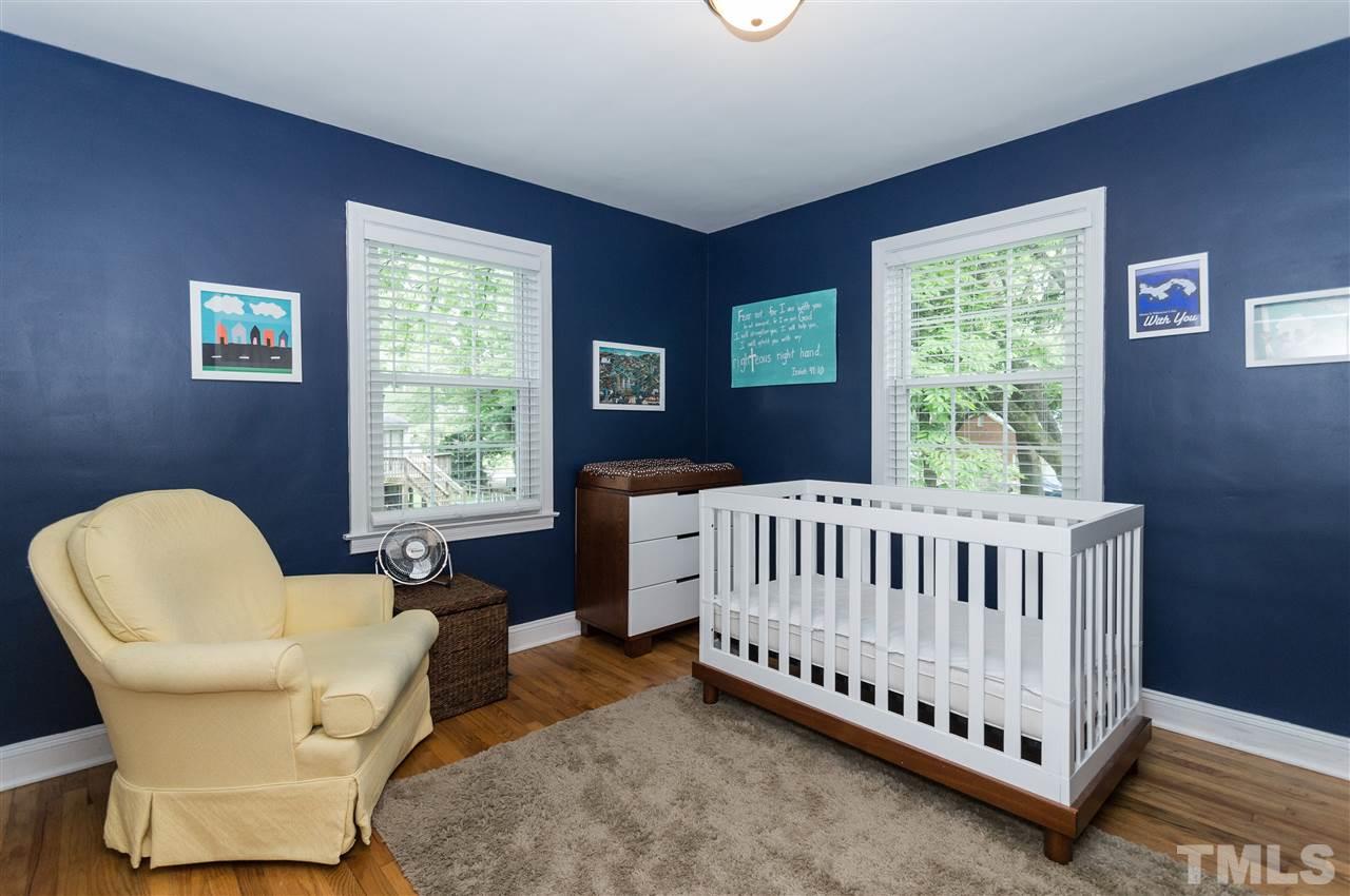 2132 Milburnie Road Raleigh, NC 27610 - Photo 14 of 23 a bed room with a bed and a chair