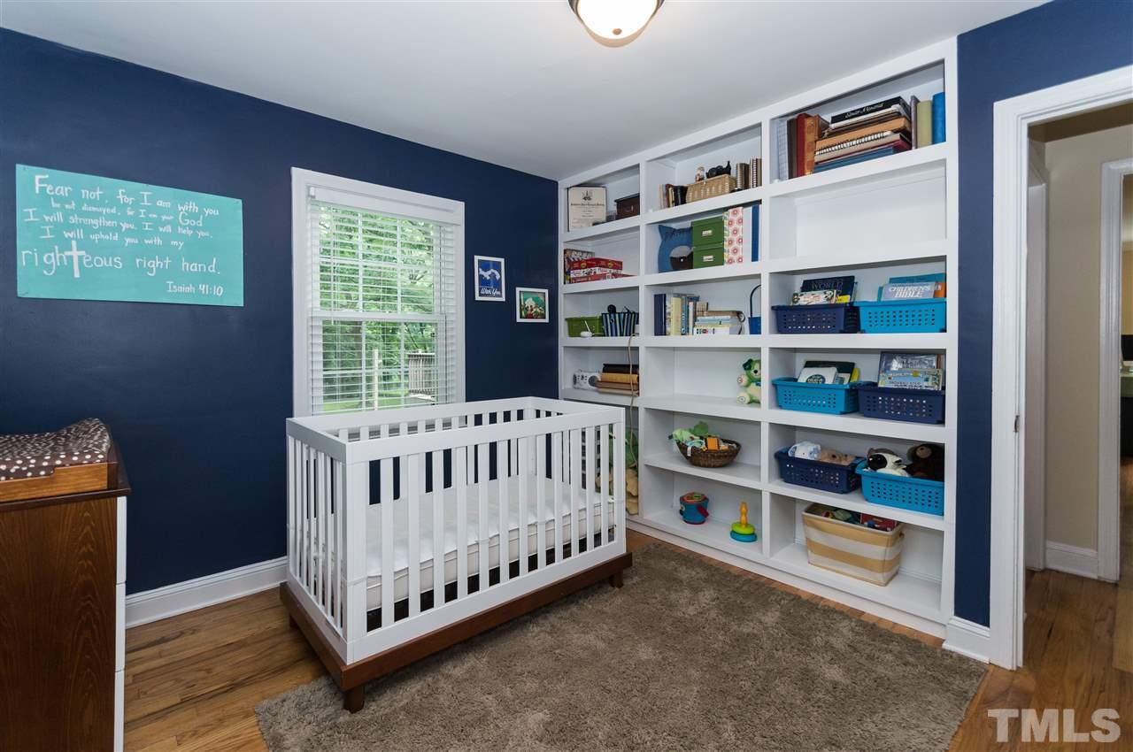 2132 Milburnie Road Raleigh, NC 27610 - Photo 15 of 23 a bedroom with a bed and a window