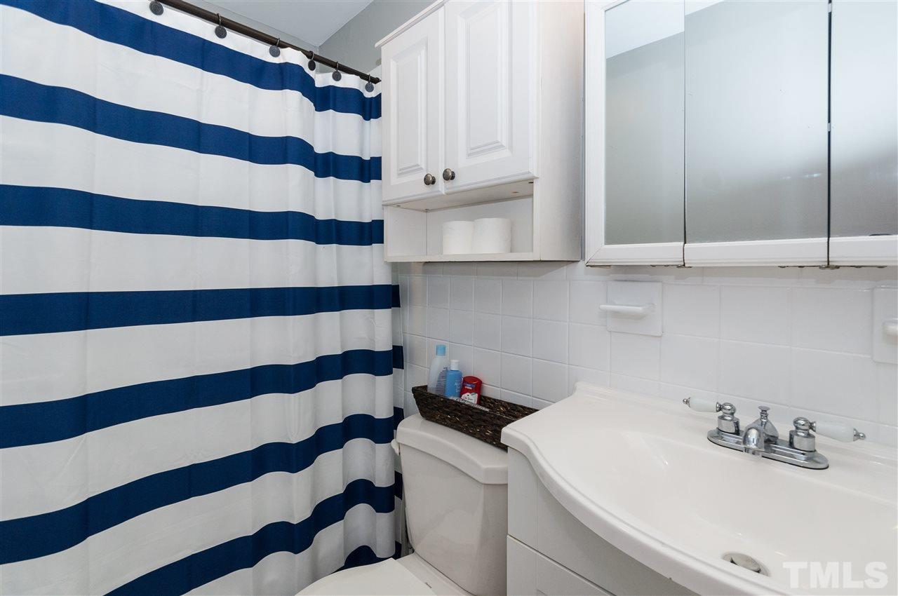 2132 Milburnie Road Raleigh, NC 27610 - Photo 16 of 23 a bathroom with a sink and a mirror