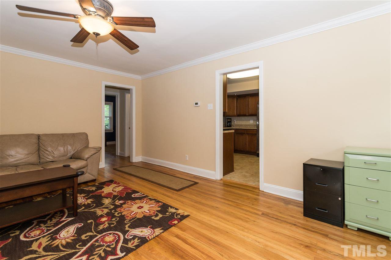 2132 Milburnie Road Raleigh, NC 27610 - Photo 3 of 23 a living room with furniture and a rug