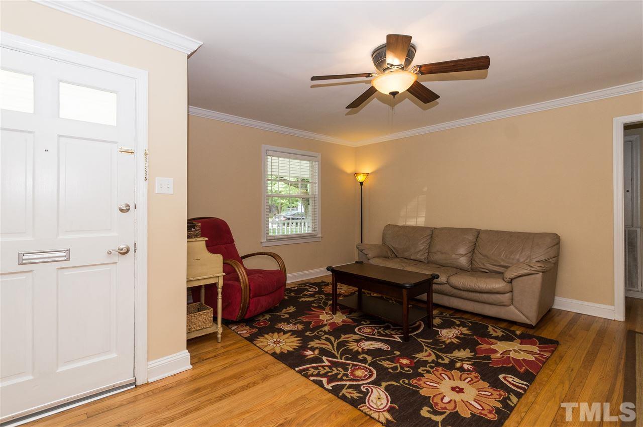 2132 Milburnie Road Raleigh, NC 27610 - Photo 4 of 23 a living room with furniture and wooden floor