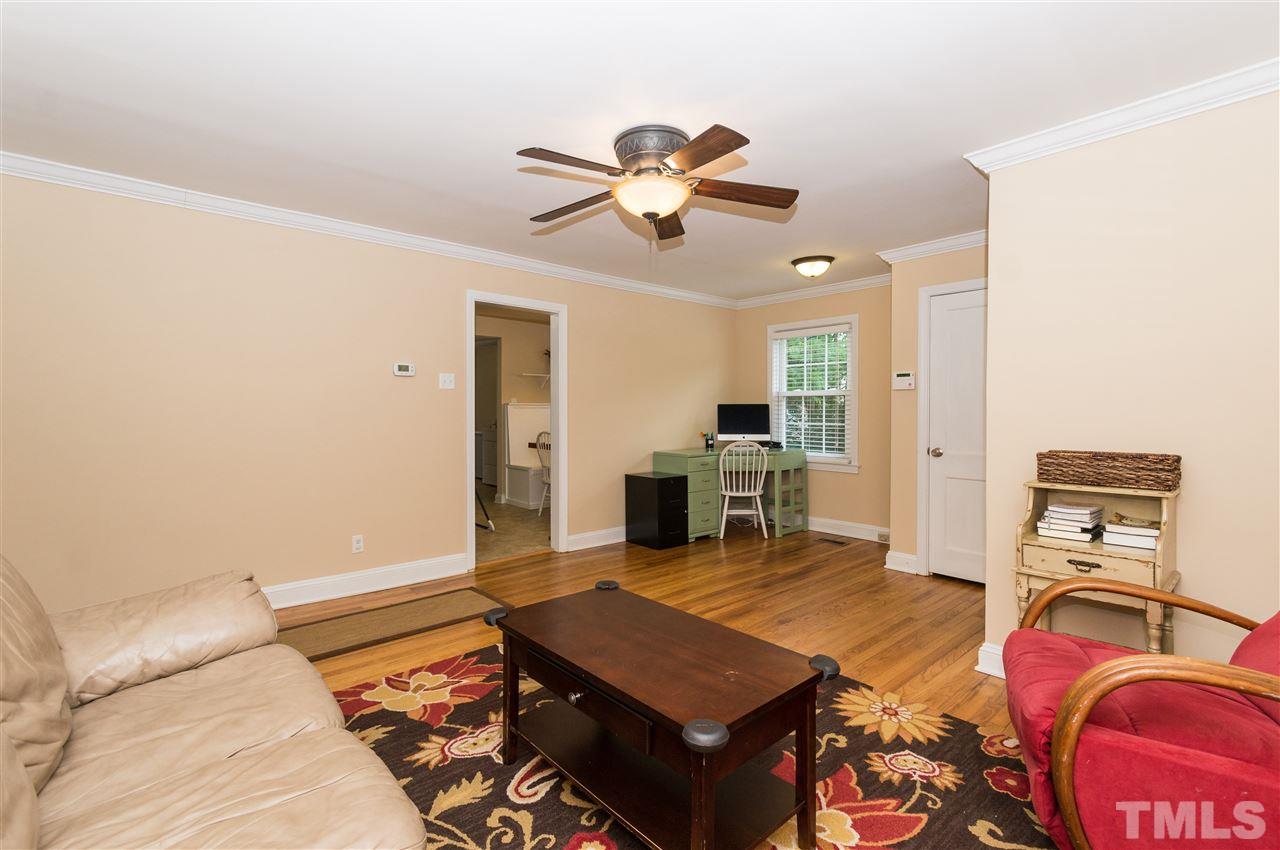 2132 Milburnie Road Raleigh, NC 27610 - Photo 6 of 23 a living room with furniture and wooden floor