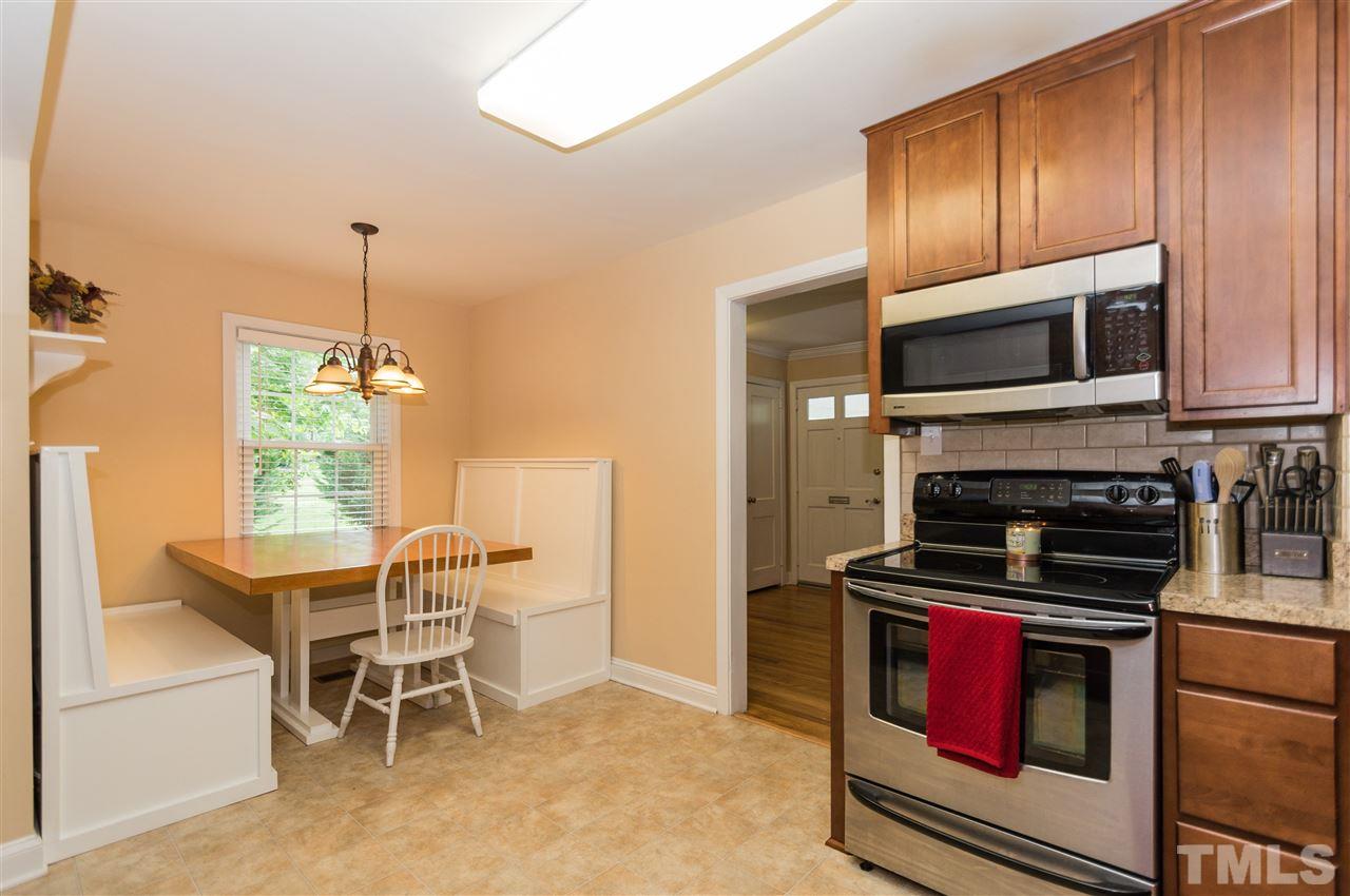 2132 Milburnie Road Raleigh, NC 27610 - Photo 10 of 23 a kitchen with a stove and a microwave