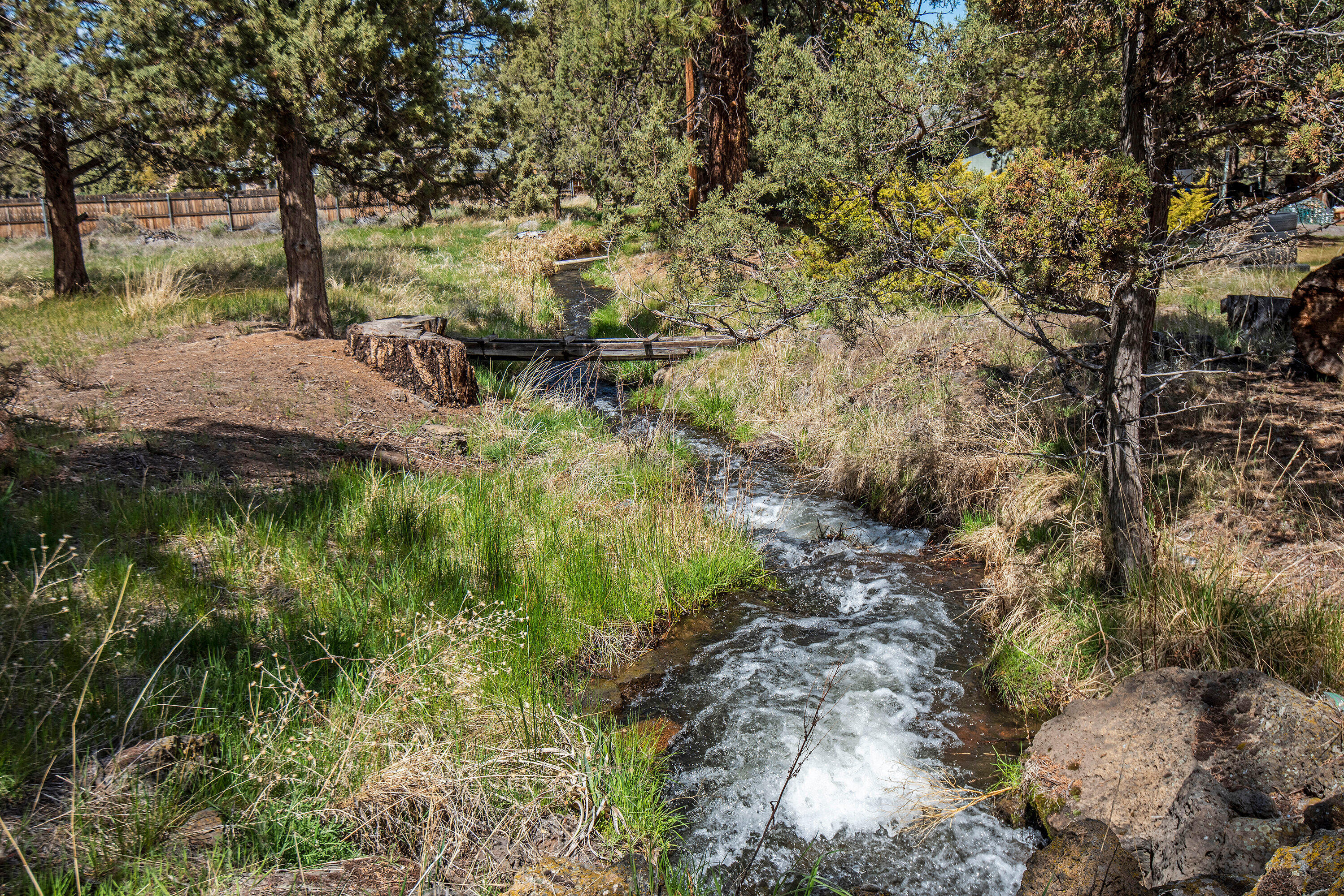 62310 Byram Road Bend, OR 97701 - Photo 2 of 21 a backyard of a house with lots of green space