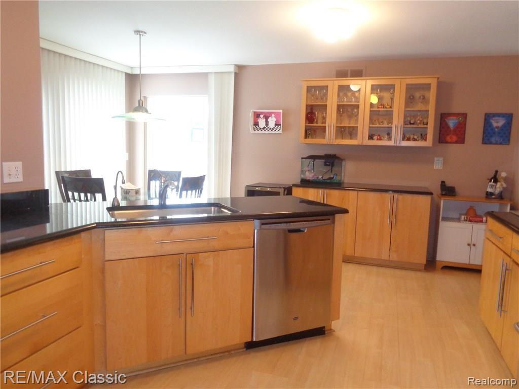 35235 Spring Hill Road Farmington, MI 48331 - Photo 16 of 28 VIEW OF MAPLE & GRANITE KITCHEN & WALL OF STORAGE