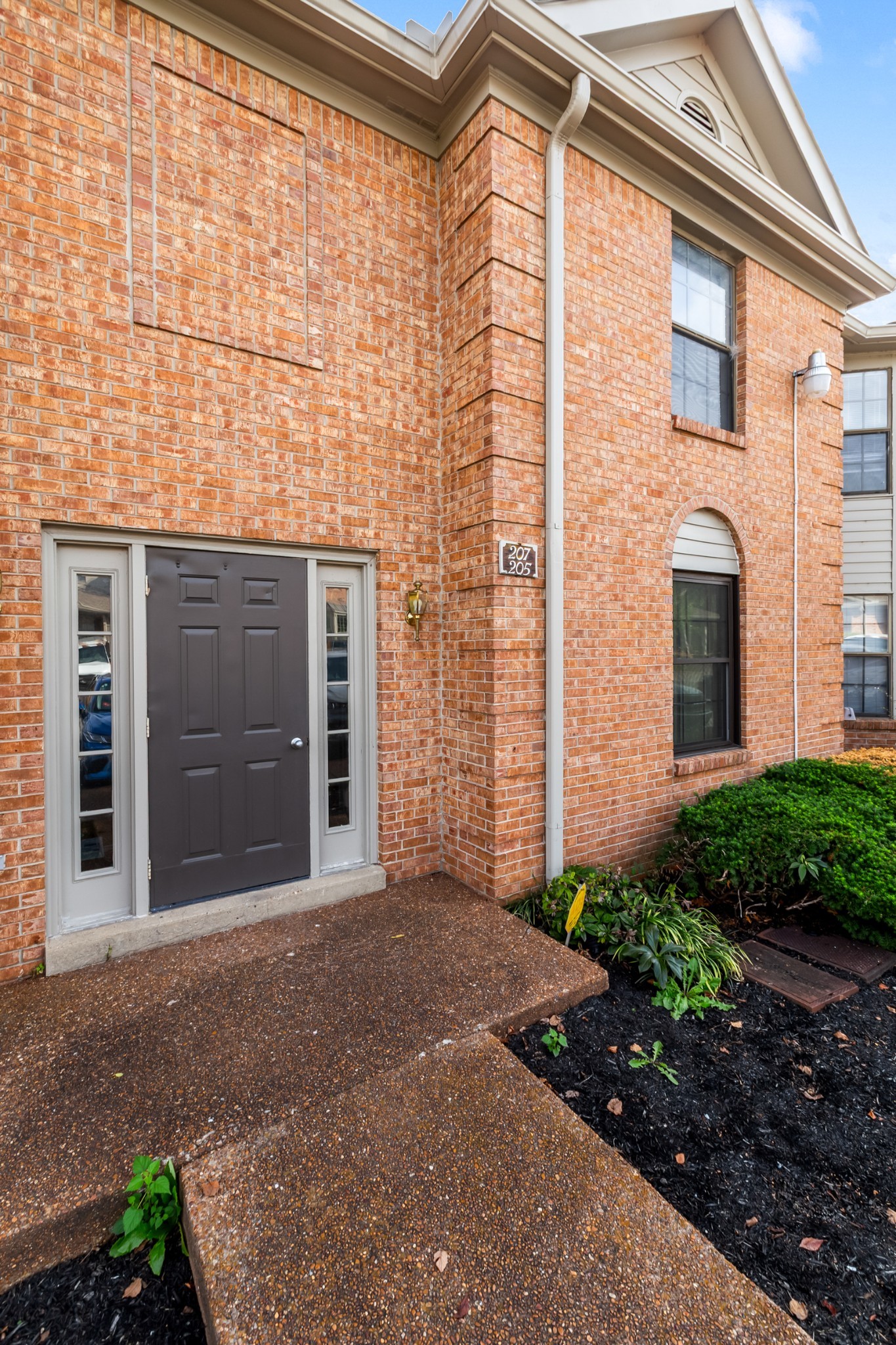 207 Ellington Place Madison, TN 37115 - Photo 20 of 24 a front view of a house with a yard