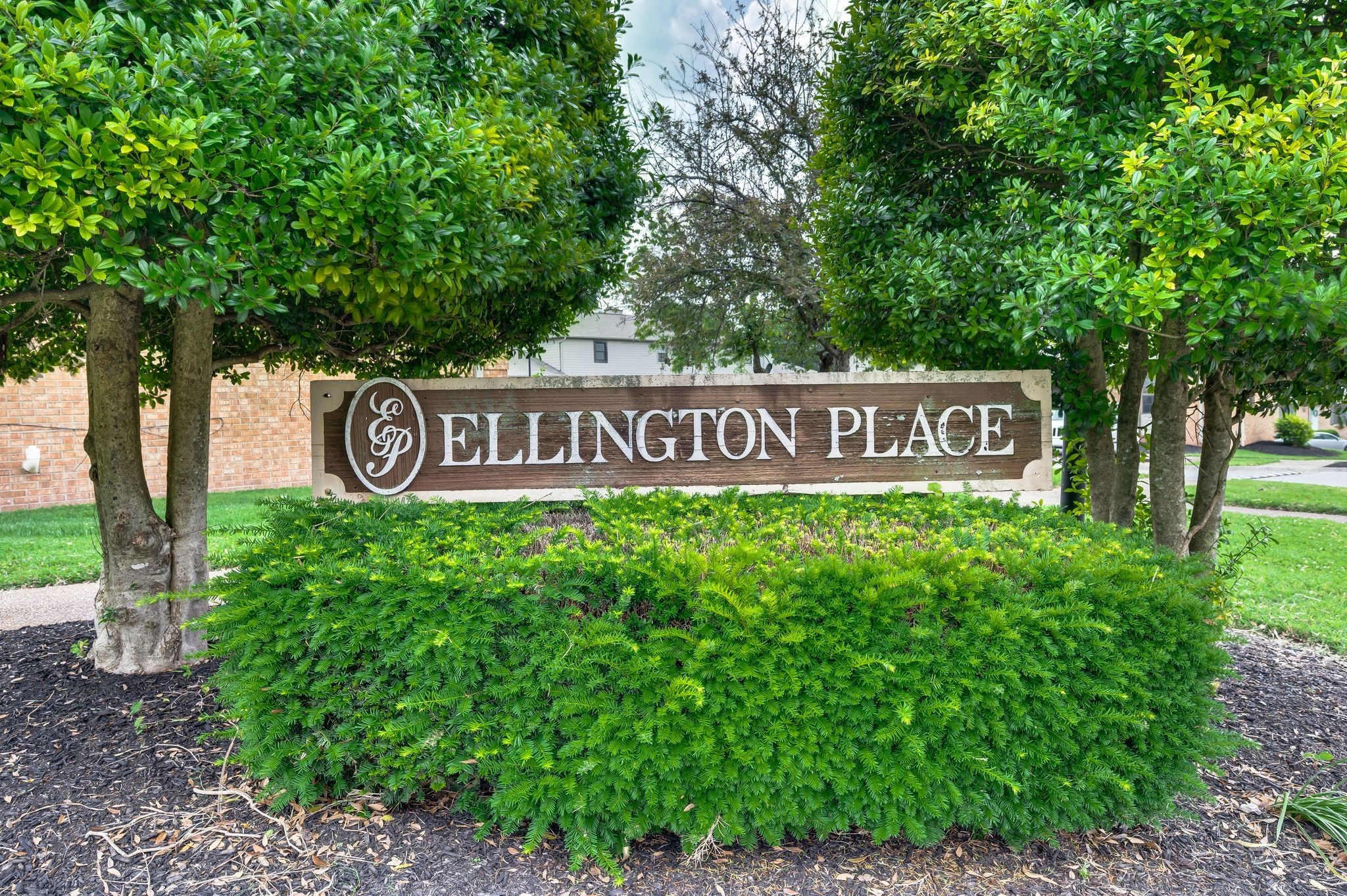 207 Ellington Place Madison, TN 37115 - Photo 2 of 24 a sign that is sitting in front of a tree