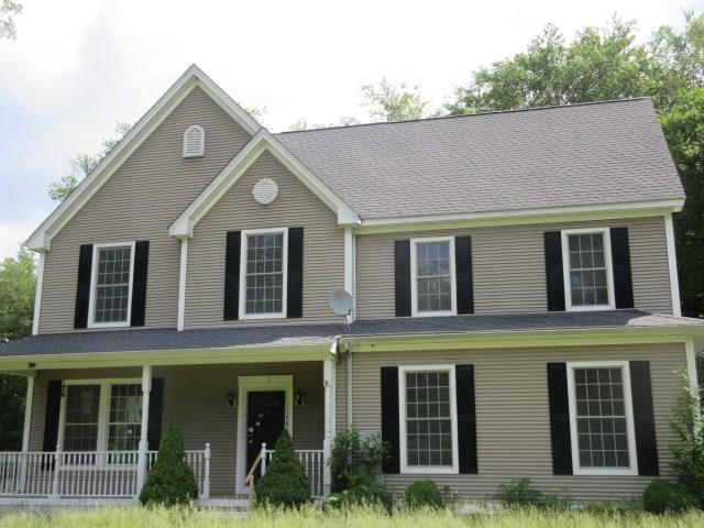 188 Moodus Road Moodus, CT 06469 - Photo 1 of 1 a front view of a house with plants and large windows