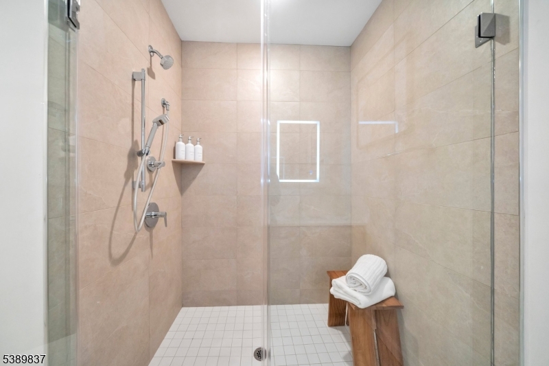 70 Ridgedale Avenue, Unit 102 Morristown, NJ 07960 - Photo 12 of 18 a bathroom with a shower