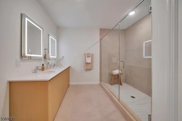 a view of a patio with chairs and potted plants