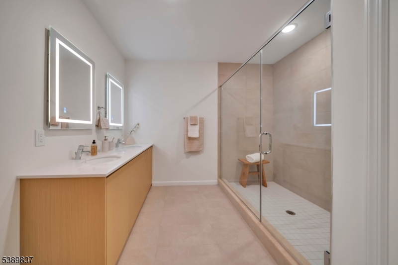 70 Ridgedale Avenue, Unit 102 Morristown, NJ 07960 - Photo 13 of 18 a bathroom with a sink a toilet and shower