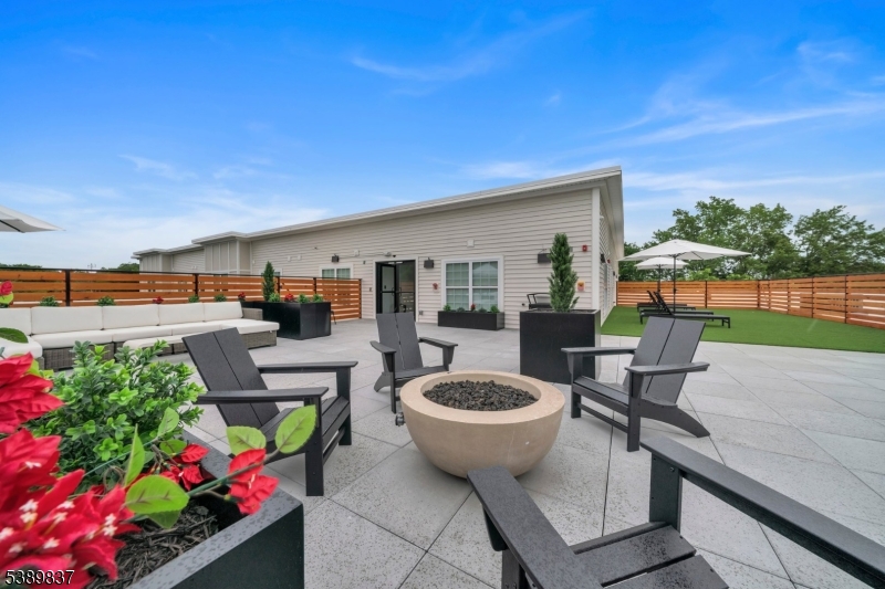 70 Ridgedale Avenue, Unit 102 Morristown, NJ 07960 - Photo 14 of 18 a view of a patio with chairs and potted plants