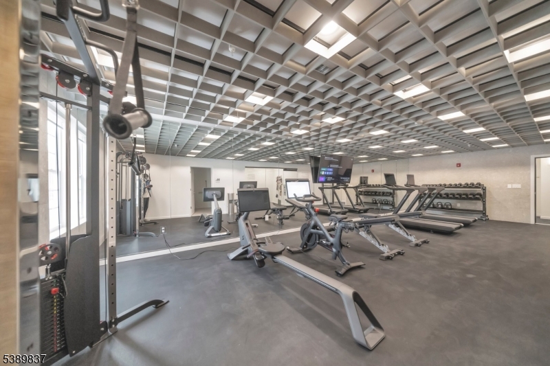 70 Ridgedale Avenue, Unit 102 Morristown, NJ 07960 - Photo 15 of 18 a view of a room with gym equipment