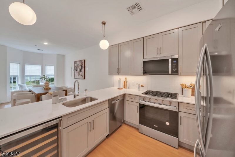 70 Ridgedale Avenue, Unit 102 Morristown, NJ 07960 - Photo 2 of 18 a kitchen with a sink stove and microwave
