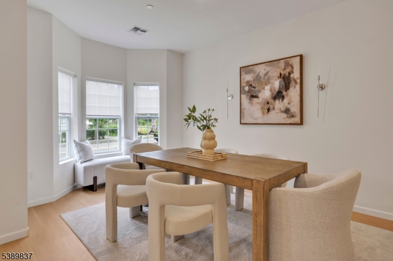 70 Ridgedale Avenue, Unit 102 Morristown, NJ 07960 - Photo 3 of 18 a view of a dining room with furniture window and outside view