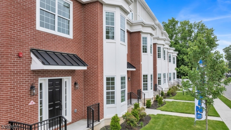 70 Ridgedale Avenue, Unit 102 Morristown, NJ 07960 - Photo 4 of 18 a front view of a house with a yard