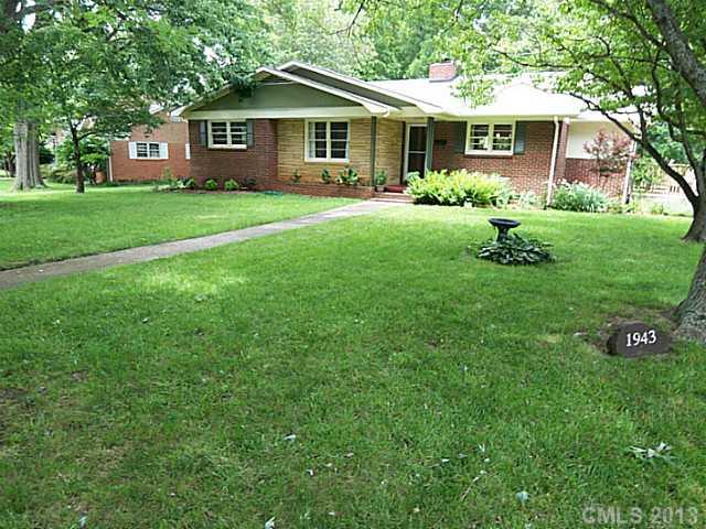 1943 Townsend Avenue Charlotte, NC 28205 - Photo 1 of 16 a front view of a house with a yard and trees