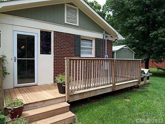 1943 Townsend Avenue Charlotte, NC 28205 - Photo 15 of 16 a view of a house with a yard and wooden deck