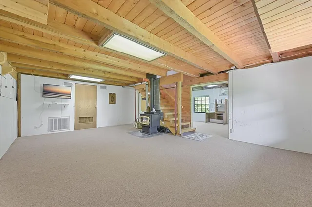a view of a livingroom with hardwood and furniture