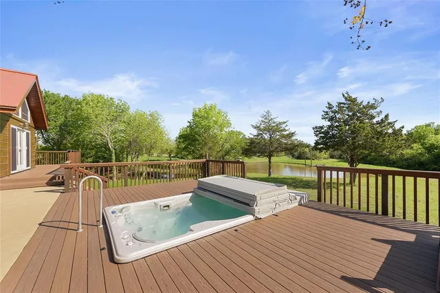 a view of deck with patio and yard