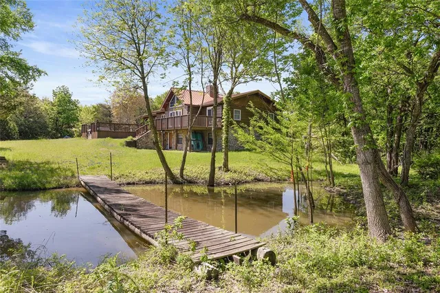 a view of a lake with a yard