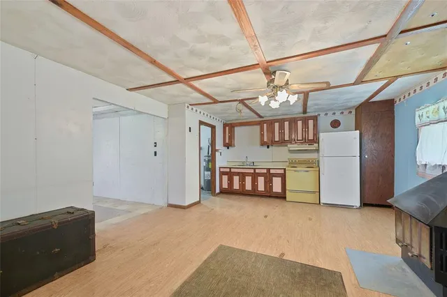 a spacious bathroom with a granite countertop sink and a large mirror