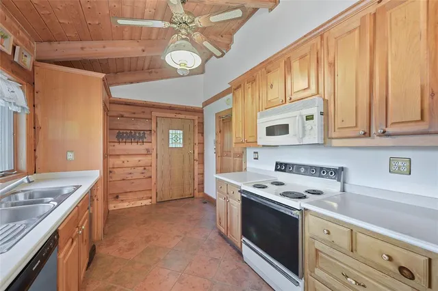 a kitchen with stainless steel appliances granite countertop a stove and a sink