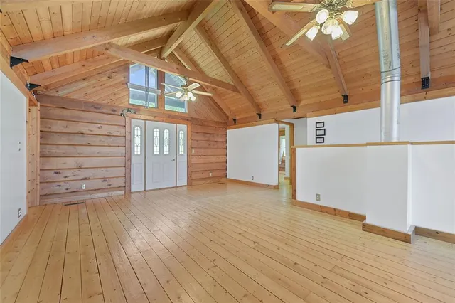 a view of a room with wooden floor